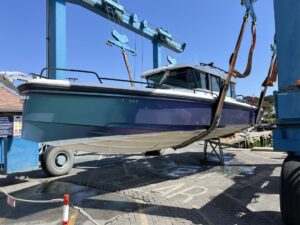 Axopar XC 37 in the hoist slings at Salterns Marina